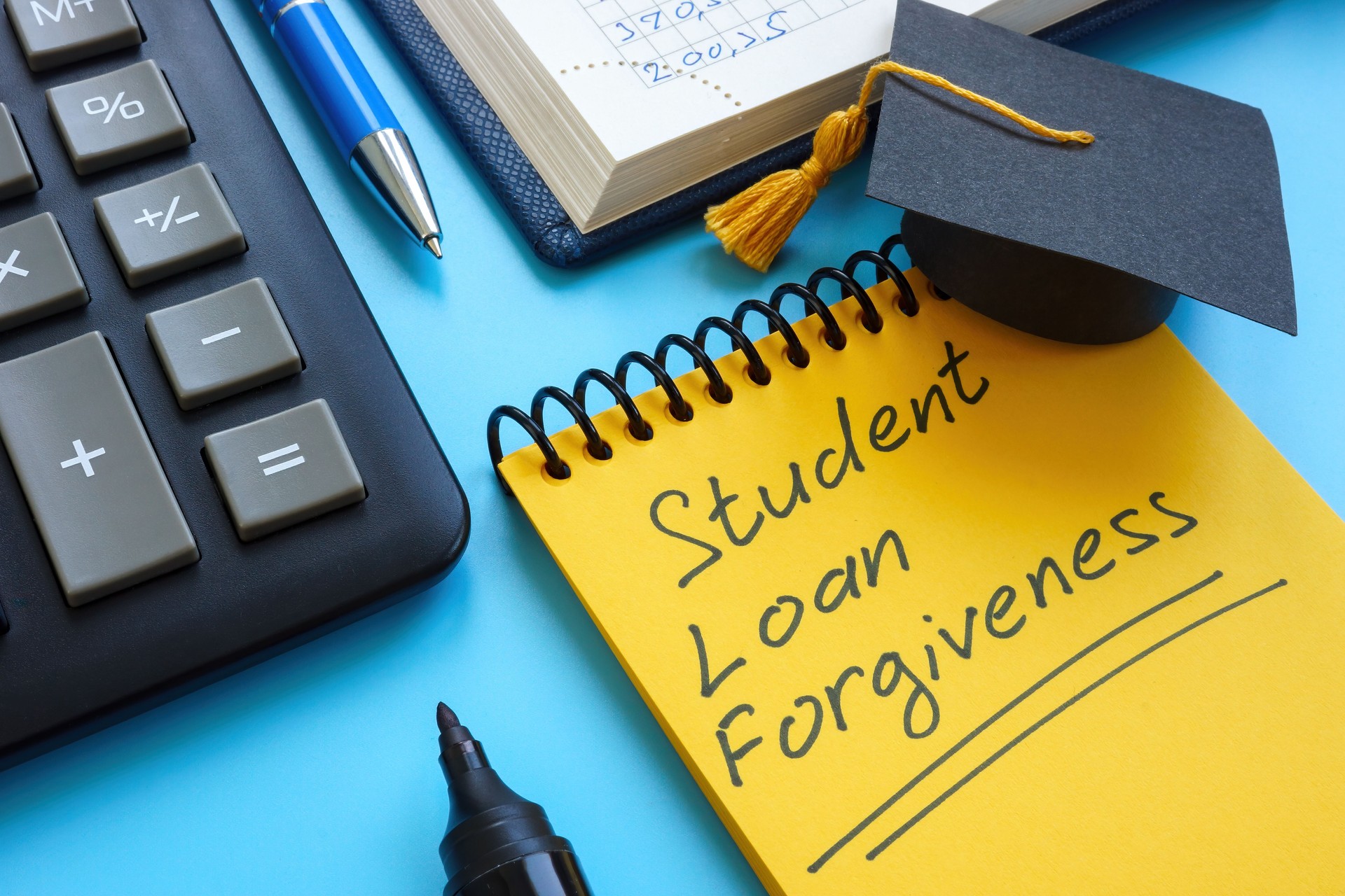 Graduation cap and Student loan forgiveness on the page.